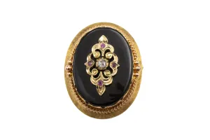 Antique gold pendant or brooch with onyx, a rose diamond and rubies in silver